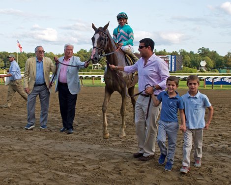 Gary Biszantz (left) leads Twisted Tom into the winner's circle at Saratoga Race Course Gary Biszantz (left) leads Twisted Tom into the winner's circle at Saratoga Race Course