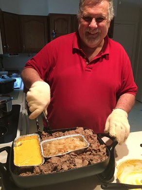 Bryan Bushey cooking cheesesteaks for the backstretch workers on his 'Surf and Turf' day Bryan Bushey cooking cheesesteaks for the backstretch workers on his 'Surf and Turf' day