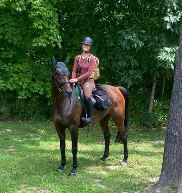Lucy Burnett on horseback, carrying a backpack and supplies in Gaucho Derby training Lucy Burnett on horseback, carrying a backpack and supplies in Gaucho Derby training