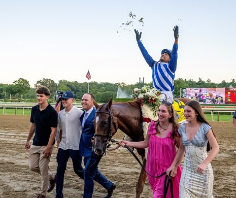 Jockey Manny Franco throws flowers in to air on the way to the winner's circle led by trainer Chad Brown, left of the horse and assisted by his family members after winning the 146th running of The Alabama Presented by Keeneland Sales GI at the Saratoga Race Course Saturday Aug.22, 2026 in Saratoga Springs, N.Y. Jockey Manny Franco throws flowers in to air on the way to the winner's circle led by trainer Chad Brown, left of the horse and assisted by his family members after winning the 146th running of The Alabama Presented by Keeneland Sales GI at the Saratoga Race Course Saturday Aug.22, 2026 in Saratoga Springs, N.Y.
