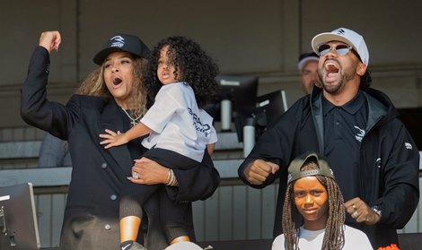 Music star Ciara holds her child and celebrate with husband NFL Star Russell Wilson after their horse Club Reign won the first race on the card on Travers Day at the Saratoga Race Course Saturday Aug.29, 2026 in Saratoga Springs, N.Y. Photo by Skip Dickstein Music star Ciara holds her child and celebrate with husband NFL Star Russell Wilson after their horse Club Reign won the first race on the card on Travers Day at the Saratoga Race Course Saturday Aug.29, 2026 in Saratoga Springs, N.Y. Photo by Skip Dickstein