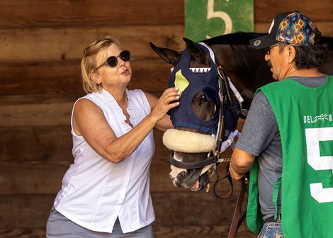 Aggie Ordonez saddling Beautiful Dawn Aggie Ordonez saddling Beautiful Dawn