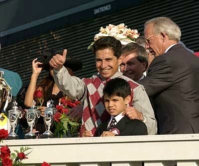 Celebrating Derby victory with son Jose Santos Jr.