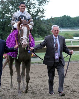 Will Take Charge with Luis Saez is led by owner Willis D. Horton towards the circle winner after their win in the 34th Pennsylvania Derby at Parx on September 21, 2013.