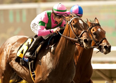 Charm The Maker and Joe Talamo (left) hold off Hard To Resist and Corey Nakatani to win the $90,000 Adoration Stakes at Del Mar.