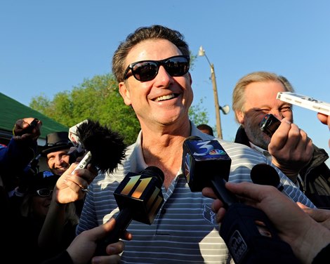 Caption:  NCAA champion coach RIck Pitino talks with media outside Goldencents&#39; Barn. works and scenes at Churchill Downs near Louisville, Ky. on May 1, 2013, during Kentucky Derby and Kentucky Oaks week. 2Works5_1_13 image738 Photo by Anne M. Eberhardt