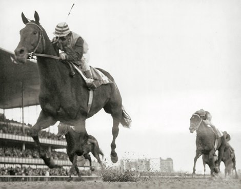 Forego and jockey Heliodoro Gustines take the 1974 Vosburgh Handicap at Aqueduct.