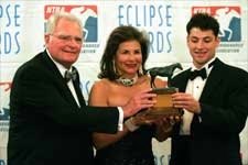 William, Suzanne, and Andrew Warren hold the Eclipse Award for Champion Older Male and Horse of the Year Saint Liam.