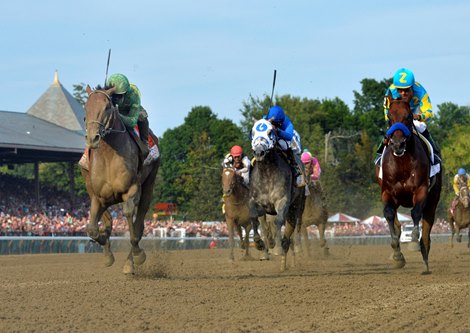 Keen Ice with jockey Javier Castellano, left overtakes American Pharoah with jockey Victor Espinoza to win the 146th running of the Travers Stakes Saturday evening Aug. 29, 2015 at the Saratoga Race Course in Saratoga Springs, N.Y.