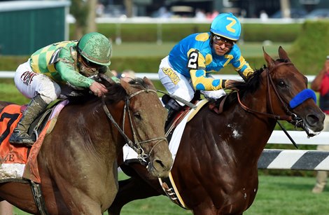 #7 Keen Ice with jockey Javier Castellano, overtakes American Pharoah with jockey Victor Espinoza to win the 146th running of the Travers Stakes Saturday evening Aug. 29, 2015 at the Saratoga Race Course in Saratoga Springs, N.Y.