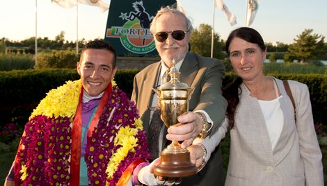 Amis Gizmo (L-R) Jockey Luis Contreras,owner Ivan Dalos, trainer Josie Carroll hold the Prince of Wales trophy after Amis Gizmo captures the 2nd. leg of the Canadian Triple crown.