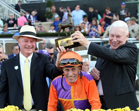 Richard Mandella, Gary Stevens, and B. Wayne Hughes celebrate after Beholder won the Breeders' Cup Distaff (GI) at Santa Anita on November 4, 2016. 