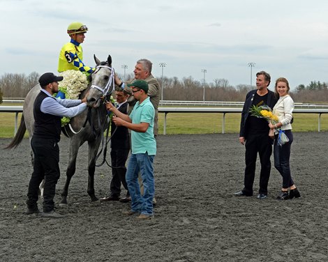 Dr. Kendall Hansen and wife on right after Fast And Accurate wins the 2017 Spiral Stakes (G3) at Turfway on March 25, 2017.