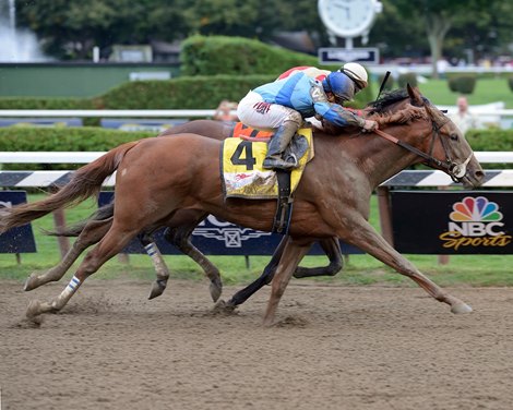 V.E. Day and jockey Javier Castellano overpower Wicked Strong to win the Grade I Travers Stakes at Saratoga Race Course on August 23, 2014. 