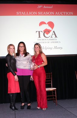 The Ellen and Herb Moelis Award is presented to the Caribbean Thoroughbred Aftercare organization represented by Erin Crady of TCA America to Kelley Stobie in red the  CFO in Puerto Rico and  CTA's co founder in Florida Shelley Blodgett   TCA 2018 Fundraiser at Keeneland 