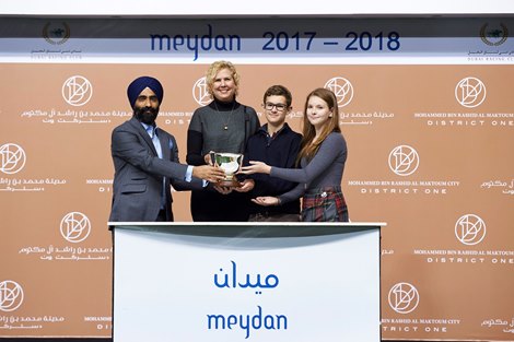 Kathy Hyde, Liam and Niamh Hyde accept the trophy for the 2018 District One Residences Handicap from Gurpal Singh