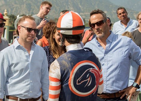Gary Fenton, left, and Billy Koch, right, of Little Red Feather Racing celebrates with jockey Geovanni Franco, center, after Fault's victory in the 2018 Adoration Stakes