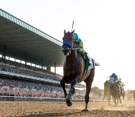 American Pharoah and jockey Victor Espinoza wins the Belmont Stakes sweeping the Triple Crown at Belmont Park on June 6, 2015. 