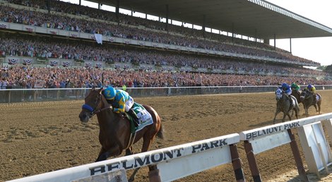 American Pharoah and jockey Victor Espinoza win the Belmont Stakes sweeping the Triple Crown at Belmont Park on June 6, 2015. 