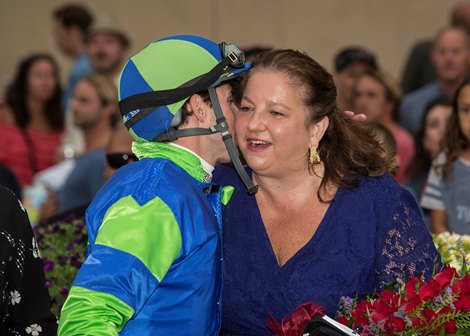 Owner Samantha Siegel, right, celebrates with track runner Joseph Talamo, left, in the winners' circle following One O One's $150,000 Real Good Deal Stakes win, Friday, July 27, 2018 at Del Mar Thoroughbred Club, Del Mar CA.