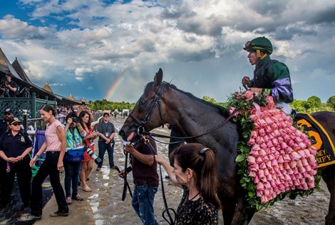 A rainbow shows up as Diversify with jockey Irad Ortiz Jr. enters the winner&#39;s circle after winning 91st running of The Whitney Stakes Saturday Aug. 4, 2018 in Saratoga Springs, N.Y.(Skip Dickstein)