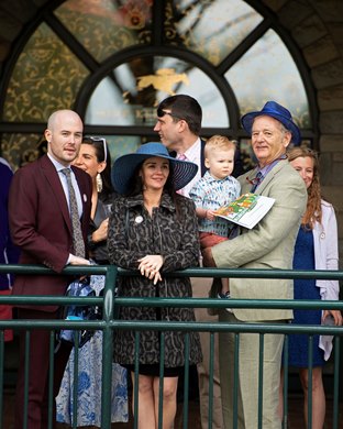 Bill Murray, on right, with his family including Luke Murray, left, daughter in law Kara Murray (blue hat) , and grandson Luke Murray (being held by Bill Murray). UL assistant Basketball coach, at Keeneland on April 12, 2019 in Lexington,  Ky. 