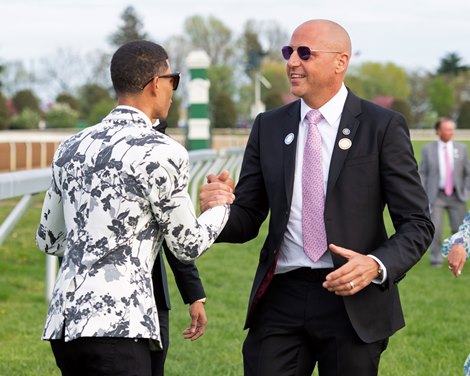 Bob Edwards, right, gets congratulations from member of Chad Brown team (Kriss Bon, groom/exercise rider). Rushing Fall with Javier Castellano wins the Coolmore Jenny Wiley (G1) at Keeneland on April 13, 2019 in Lexington,  Ky.