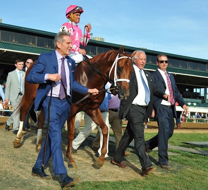 Keeneland, April 6, 2019: Co-Owners Randy Hill (L) and Michael Catsas, along with trainer George Weaver, lead Blue Grass Stakes winner Vekoma into the Keeneland  winners' circle...<br>
© Rick Samuels/The Blood-Horse