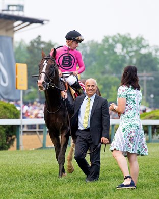 Trainer Mark Casse leads horse as wife approaches him. War of Will with Tyler Gaffalione wins the Preakness Stakes (G1) at Pimlico Race Course in Baltimore, Md. May 18, 2019 in Baltimore,  Md.<br><br />
