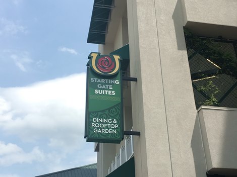 A sign directing patrons to the Starting Gate Suites and new Rooftop Garden at Churchill Downs