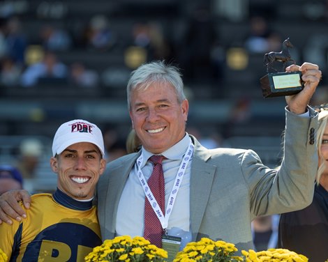 Four Wheel Drive and Irad Ortiz, Jr. with trainer Wesley Ward after winning the Breeders&#39; Cup Juvenile Turf Sprint at Santa Anita Park on November 1, 2019 in Arcadia, California. Photo by Skip Dickstein 