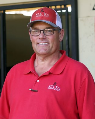 Scott Kintz with Hip 45 who enjoyed eating his sign,, 2020 March  OBS Sale of 2 Y O