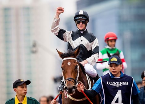 SHA TIN, HK - DECEMBER 09: Zac Purton celebrates aboard Exultant at the Longines Hong Kong International Races at Sha Tin Racecourse on December 09, 2018 in Sha Tin, Hong Kong.