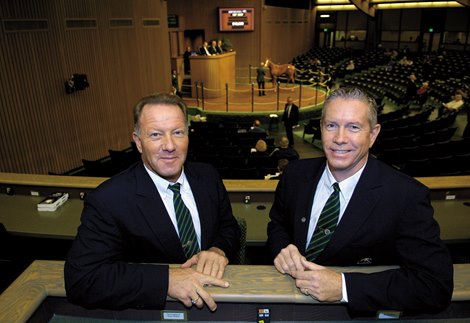 l-r, Cris and Scott Caldwell in the Keeneland sales pavilion with the Keeneland January Sales going on in the background on January 14, 2007, in Lexington, Ky.<br>
Caldwell Origs image 165<br>
Photo by Anne M. Eberhardt