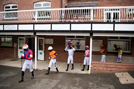 The jockeys walk out of the weighing room for Division 2 of the 6f RIU Hotels And Resorts Worldwide Maiden Stakes  at Pontefract Yorkshire 10.6.20<br>
Pic: Edward Whitaker