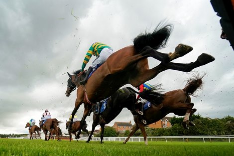 STRATFORD, ENGLAND - JULY 08: A general view as runners clear a flight of hurdles in The Irish Thoroughbred Marketing Mares&#39; Novices&#39; Hurdle (GBB Race) (Div 2) at Stratford racecourse on July 08, 2020 in Stratford, England