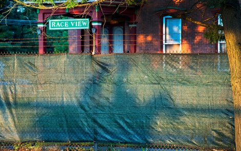 Exercise rider’s shadows are captured on the new privacy fence in stalled on the Nelson Avenue side of the main track the day before opening day at Saratoga <br><br />
Race Course July 15, 2020 in Saratoga Springs, N.Y.  Photo by Skip Dickstein/