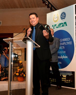 Saul Castellanos accepts his TIEA award