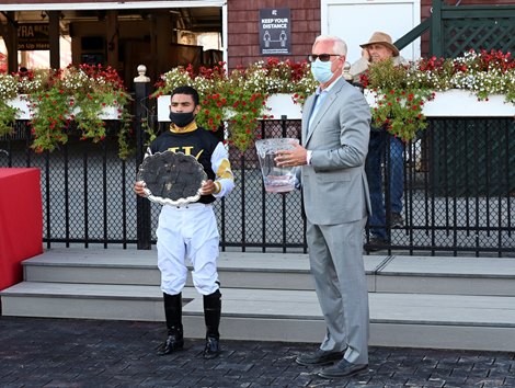 Jockey Luis Saez, left and trainer Todd Pletcher accept the winners trophy after Halladay win the36th running of The Fourstardave  Saturday Aug.22, 2020 at the Saratoga Race Course in Saratoga Springs, N.Y. Photo by Skip Dickstein