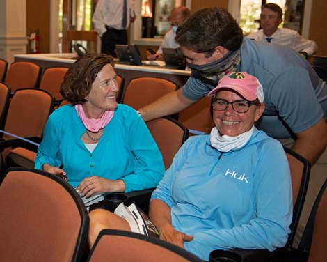 Buyer Marette Farrell (left) gets congratulated by Conrad Bandoroff. Tescha Von Bluecher (part of Marrette’s team with Zoe Cadman not pictured). Hip 400 colt by American Pharaoh out of Swingit from Denali<br><br />
Fasig-Tipton Selected Yearlings Showcase in Lexington, KY on September 10, 2020.
