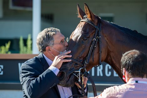 Neil Pessin kisses Bell's the One with Corey Lanerie after winning the Derby City Distaff (G1) at Churchill Downs, Louisville, KY on September 5, 2020.