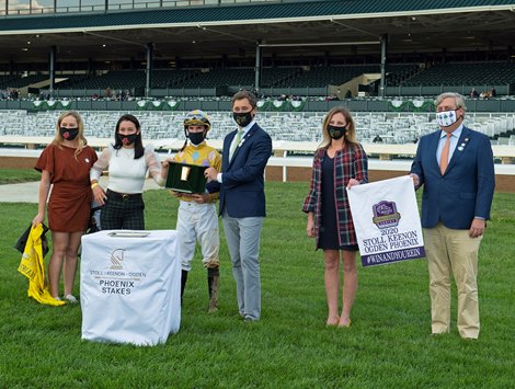 (L-R): unknown part of training team, Andie Biancone, Florent Geroux, Chapman Hopkins, Sarah Reeves, and Drew Fleming. Diamond Oops with Florent Geroux wins the Stoll Kenos Ogden Phoenix (G2) at Keeneland.<br><br />
Opening day of the Keeneland fall meeting on October 2, 2020.