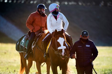 Tiz the Law with exercise rider Heather Smullen returns from a morning gallop with trainer Barclay bringing up the rear on his horse at Keeneland Race Course Monday Nov. 2 2020 in Lexington, KY.  Photo by Skip Dickstein