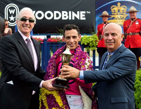 159th Queen&#39;s Plate Stakes Wonder Gadot<br> Owner Gary Barber (L)  Jockey John Velazquez, trainer Mark Casse, hold the Queen&#39;s Plate trophy after capturing the Plate