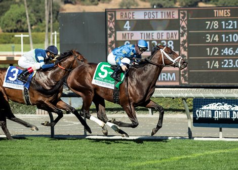 Smooth Like Strait and jockey Umberto Rispoli, right, outleg Storm the Court (John Velazquez), left, to win the G2, $200,000 Mathis Brothers Mile, Saturday, December 26, 2020 at Santa Anita Park, Arcadia CA.