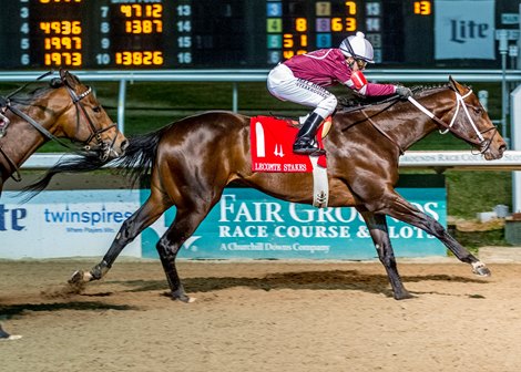 1/16/2021  -  Joe Talamo aboard Midnight Bourbon holds off challengers to win the 77th running of the Grade III $200,000 LeComte Stakes at Fair Grounds.  Hodges Photography / Lou Hodges, Jr.