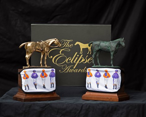 Eclipse Horse of the Year, left, and standard Eclipse Award, right, with Spendthrift Farm masks. Eclipse Award images near Versailles, Ky., on Jan. 5, 2021. 