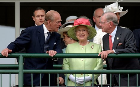 British monarch Queen Elizabeth II (center) enjoys her first Kentucky Derby with husband Prince Philip (left) and former U.S. Ambassador Will Farish of Lane's End Farm.