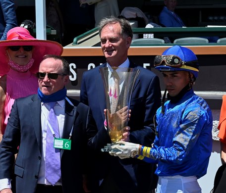 Jockey Jose Ortiz Jr.,right, is joined by Jimmy Bell, center, representative of Godolphin and Sheik Mohammad after  Maxfield won the in 18th running of The Alysheba at Churchill Downs Race Track Friday  April 30, 2021 in Louisville, Kentucky