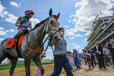 Jockey Jose Ortiz brings Obligatory to the winner’s circle after winning the 66th running of The Eight Belles at Churchill Downs Race Track Friday  April 30, 2021 in Louisville, Kentucky